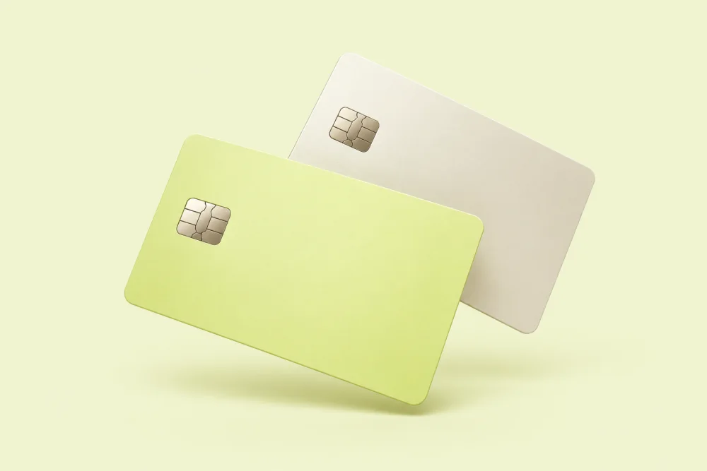 Two floating unbranded lime and ivory payment cards, illustrative only